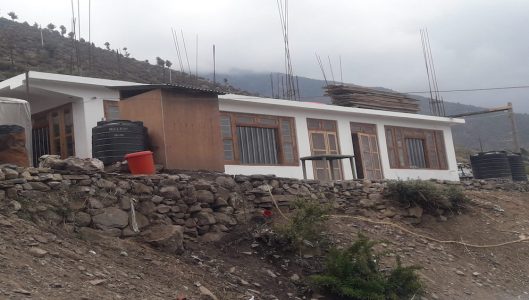 Ground-floor-building-south-side-with-a-temporary-toilet-outside-scaled